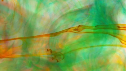 Brightly colored clouds of smoke dance and twist. yellow, blue, green red mix Video stock 247782831