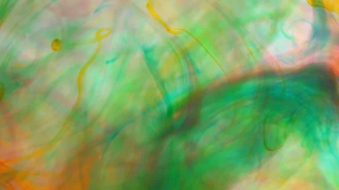 Brightly colored clouds of smoke dance and twist. yellow, blue, green red mix Video stock 247782961