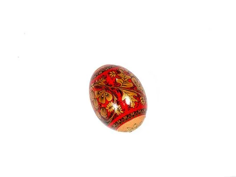 Brightly colored Easter egg with patterns, isolated on white Photos
