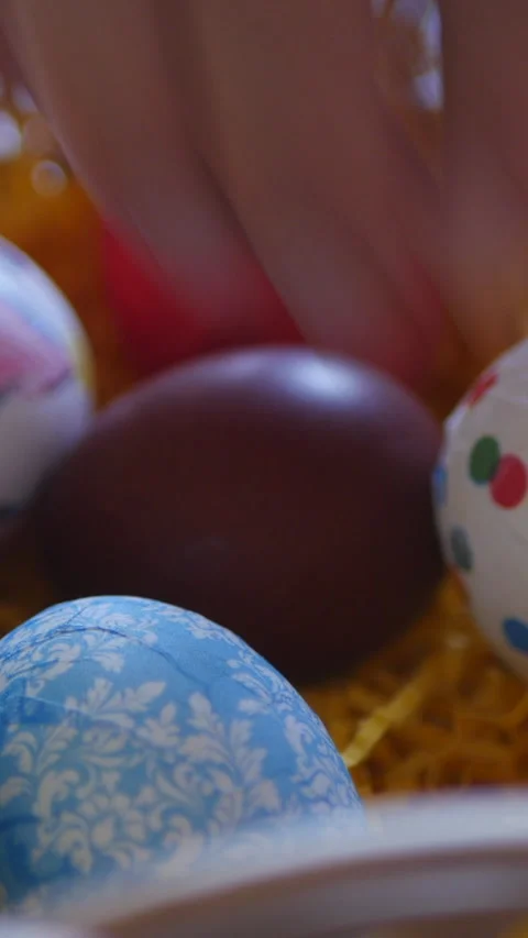 Brightly Colored Easter Eggs Arranged In A Basket With Festive Details. Vertical Video stock 303482691