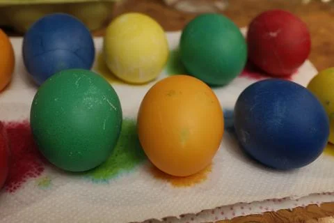 Brightly colored Easter eggs on a paper towel Stock Photos