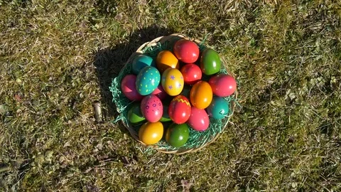 Brightly colored eggs on grass Stock Footage 83549388