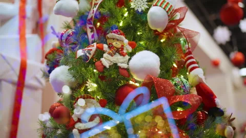 Brightly colored handcrafted santa figure displayed among joyful holiday Stock Footage 321303624