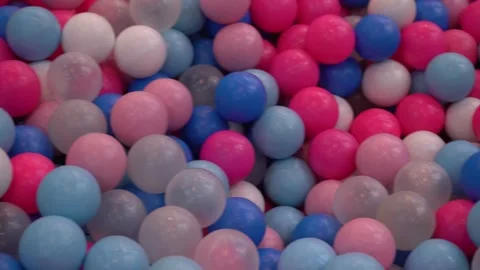 Brightly colored plastic balls in a ball pit at a children's playground. Stock Footage 296891434