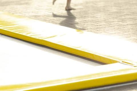 Brightly colored rubber border outlining informal summer play areas 写真素材