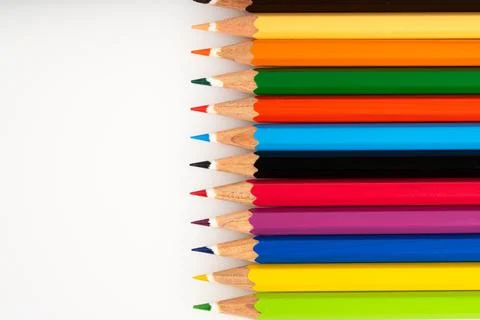 Brightly Colored Sharpened Pencils Create a Vertical Rainbow Stripe on a Pu.. Stock Photos