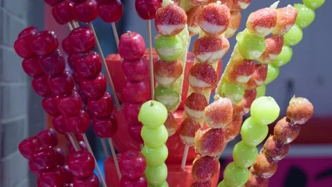Brightly colored sugar-coated haws, Chinese specialty snack sugar-coated haws Stock Footage 322778918
