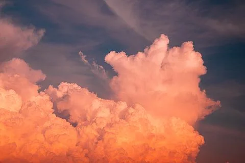 Brightly Colored Sunset Clouds Illuminating the Evening Sky Stock Photos