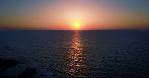 Brightly colored sunset over the calm Mediterranean Sea. Drone Point of View . Stock Footage 74173101