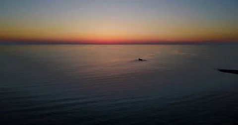 Brightly colored sunset with ship over the calm Mediterranean Sea. Stock Footage 74564706