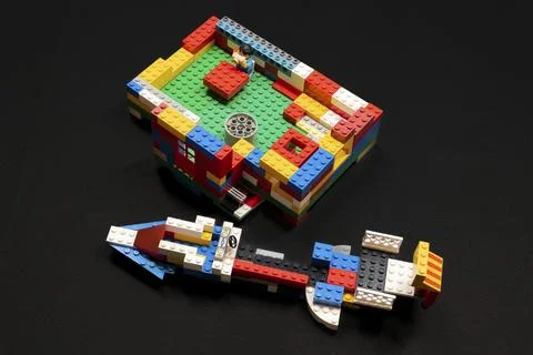 Brightly colored toy bricks form a playful vehicle Stock Photos