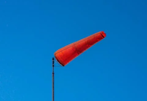 A brightly colored windsock in the sky Stock Photos
