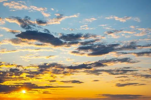 Brightly colorful clouds in the evening sky. Lush colored clouds in the sky.. Stock Photos