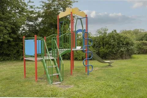 Brightly coloured childrens outside play and climbing equipment Stock Photos