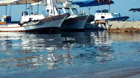 BRIGHTLY COLOURED MEDITERRANEAN FISHING BOATS ALANYA GAZIPASA Stock Footage