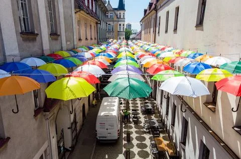 Brightly coloured umbrellas decorate the Bankowa Street in Pszczyna, Poland - 16 Stock Photos