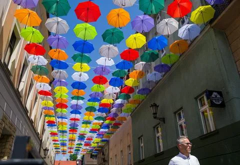 Brightly coloured umbrellas decorate the Bankowa Street in Pszczyna, Poland - 16 Stock Photos