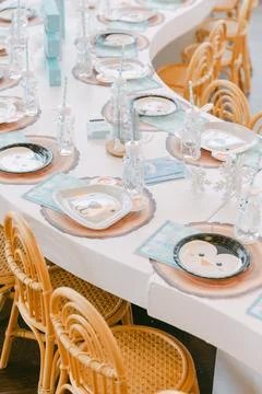 Brightly decorated dining table ready for a festive gathering with cheerful Stock Photos