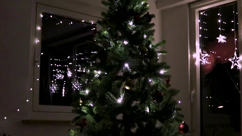 Brightly Lit Christmas Tree Decorations Create a Cozy Holiday Atmosphere at Home Stock Footage 301135333