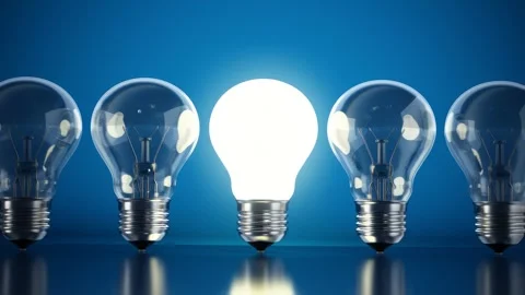 Brightly lit lightbulb standing out from dimmed lightbulbs Stock Footage 285499057