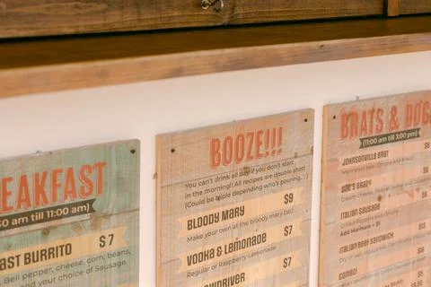 Brightly lit restaurant menu featuring diverse food and drink options located in Stock Photos