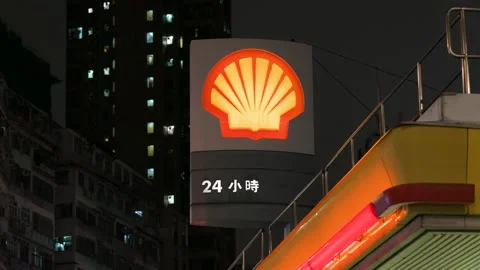Brightly Lit Shell Petrol Station Stands Out in Hong Kong Nightscape - Key Fuel 動画素材 306926551