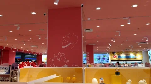 Brightly Lit Store Interior with Playful Decorations and Vibrant Colors Stock Footage 305394472
