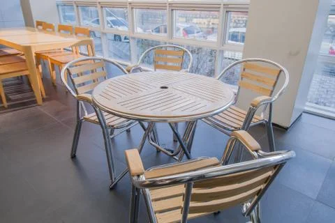 Brightly lit study area with large windows Stock Photos