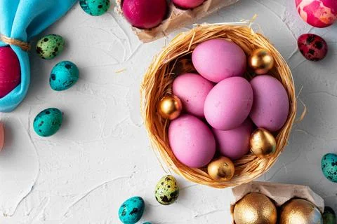 Brightly painted Easter eggs composition on white embossed background Stockfoto's