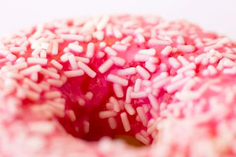 Brightly pink donut on a white background. Macro. Selective focus. Foto stock