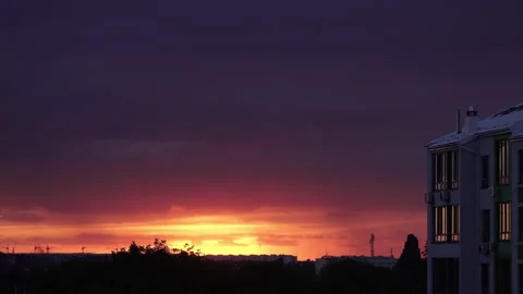 Brightly red cumulus clouds swirl at sunset Beautiful sunset Stock Footage 161332151