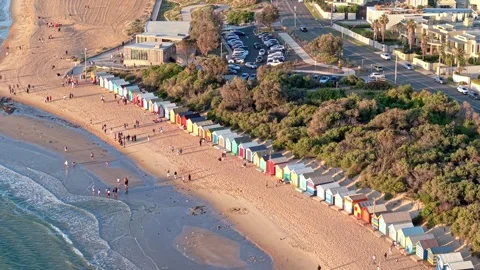 Brighton Beach Boxes with Melbourne Skyline at Sunset Stock Footage 329167888