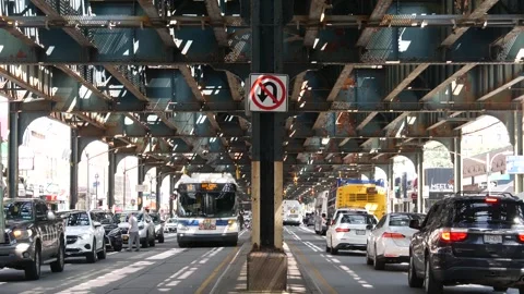 Brighton Beach elevated subway and road in Brooklyn. Street under metro bridge Stock Footage 326275573