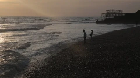 Brighton Beach at Sunset with Orange/Red Sky | HD 1080 Stock Footage 47716616