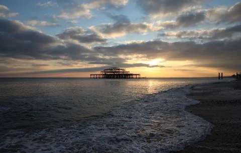Brighton pier sunset waves Stock Photos