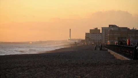 Brighton seaside uk beach sunset waves woman walking silhouette Video stock 70532989