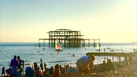 Brighton West Pier from packed beach at sunset Stock Footage 342070373