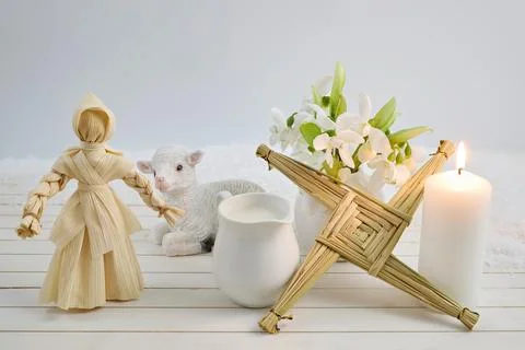 Brigids cross, corn doll, lamb, and candle for imbolc Stock Photos
