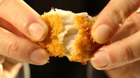 Briking a Crispy Fish Finger Stock Footage 49499359