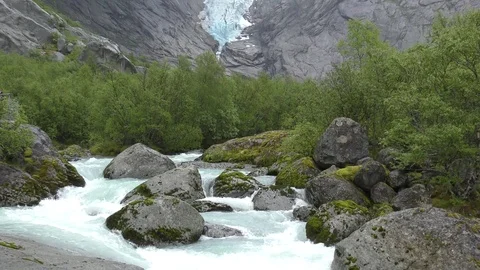 Briksdal glacier dramatic flowing river Norway Video stock 77239401