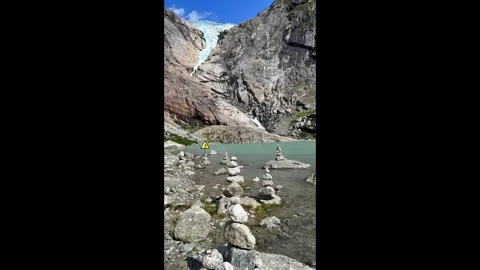 Briksdalsbreen lake and ice and mountains Stock Footage 337364523