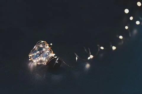 Brilliant creativity, idea lightbulb wrapped up in string lights shining all  Stock Photos