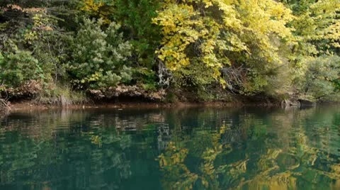 Brilliant fall colors on a lake Stock Footage 8960725