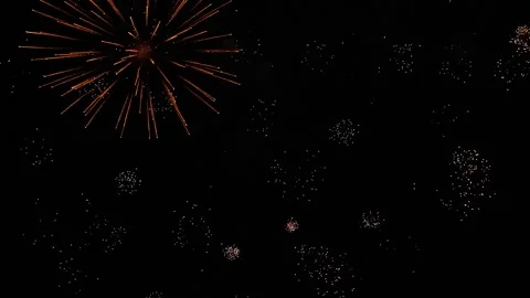 Brilliant firework bursts draw patterns in dark evening sky on holiday party Stock Footage 277266504