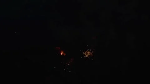 Brilliant golden firework burst with glowing sparks in dark sky Stock Footage 334590308
