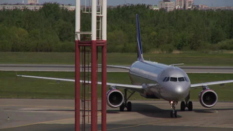 A brilliant gray plane carries out taxiing on the strip Stock Footage 92199191