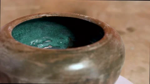 Brilliant green glaze as primitive processing on baked clay FDV 動画素材 150796199