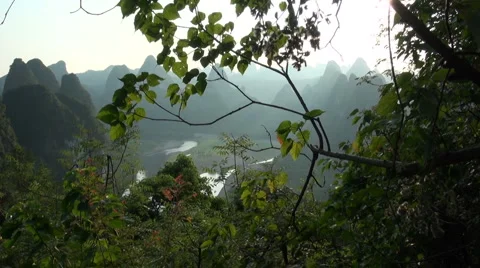 Brilliant karst scenery behind trees Stock Footage