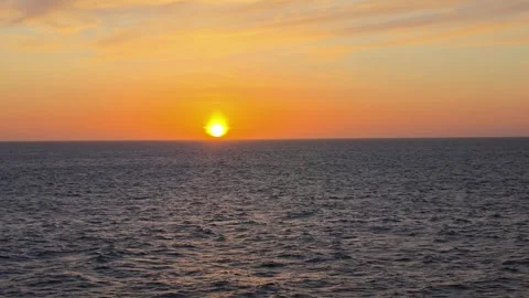Brilliant Orange Sunset Over Open Atlantic Ocean Horizon from Ship Deck 動画素材 332737441