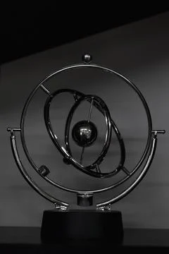 A brilliant pendulum is a perpetual motion machine in the form of spinning sp Stock Photos